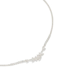Crafted from silver plated metal, this cubic zirconia dainty floral cupchain necklace in a close up view - link has visual effect only