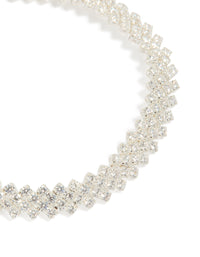 Highlighting a diagonal round cubic zirconia bracelet in silver plated material close up view - link has visual effect only