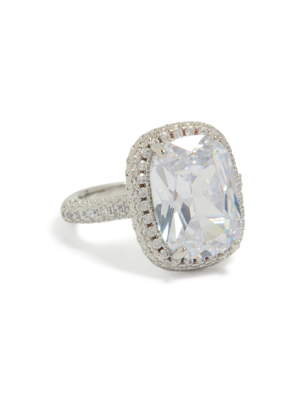 Showcasing a statement ring with cushion cut cubic zirconia, halo setting, and crystal accents in silver and clear front view