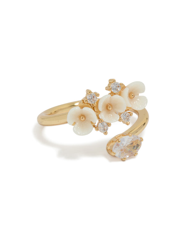 Beautifully crafted gold plated triple flower wrap ring featuring floral design with ivory and white statement front view