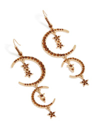 Showcasing statement celestial charm drop earrings with double moon design in gold and maroon front view - link has visual effect only