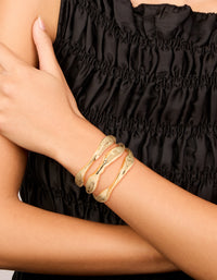 Featuring a gold irregular line wrist cuff in statement style on wrist view - link has visual effect only