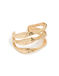 Showcasing a gold irregular line wrist cuff with statement design front view - link has visual effect only
