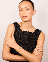 Crafted with gold irregular line wrist cuff design in statement on model view - link has visual effect only