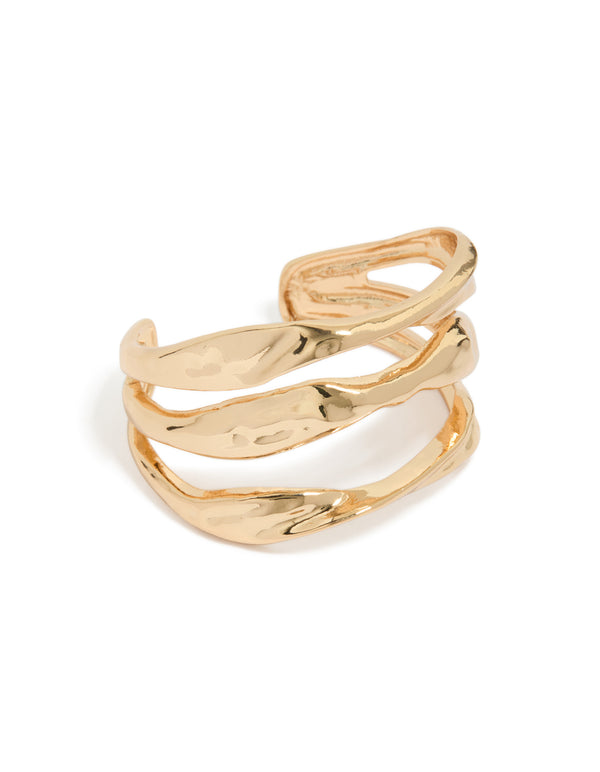 Showcasing a gold irregular line wrist cuff with statement design front view