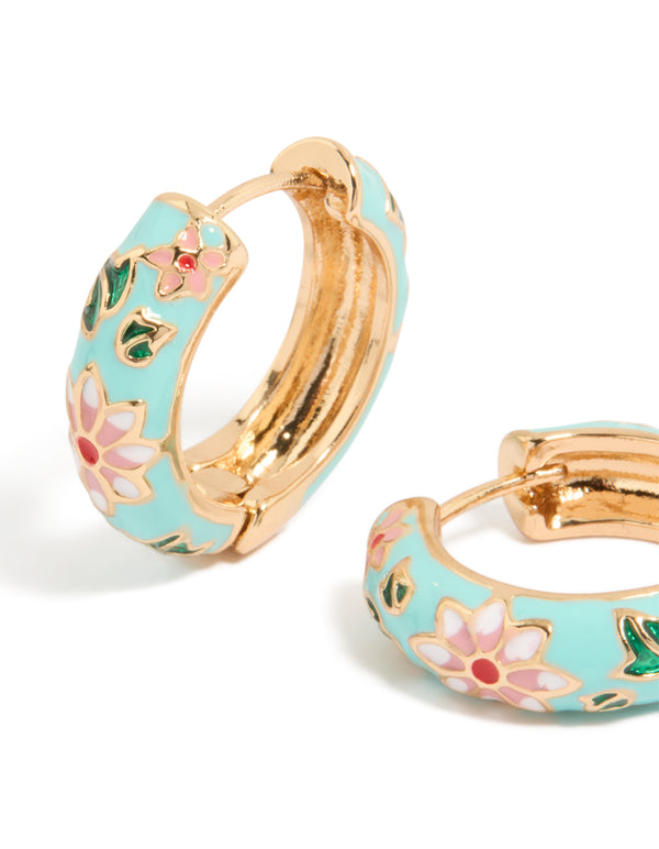 Elegant thick gold huggie earrings adorned with light blue enamel, floral print, leaf motifs in turquoise, pink and green close up view