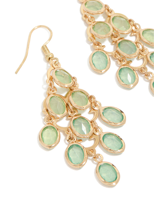 Beautifully designed gold green diamantes cascading drop earrings with statement detailing close up view