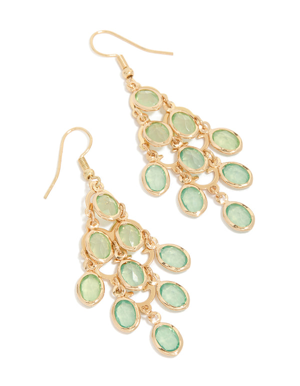Showcasing gold green diamantes cascading drop earrings in statement style front view
