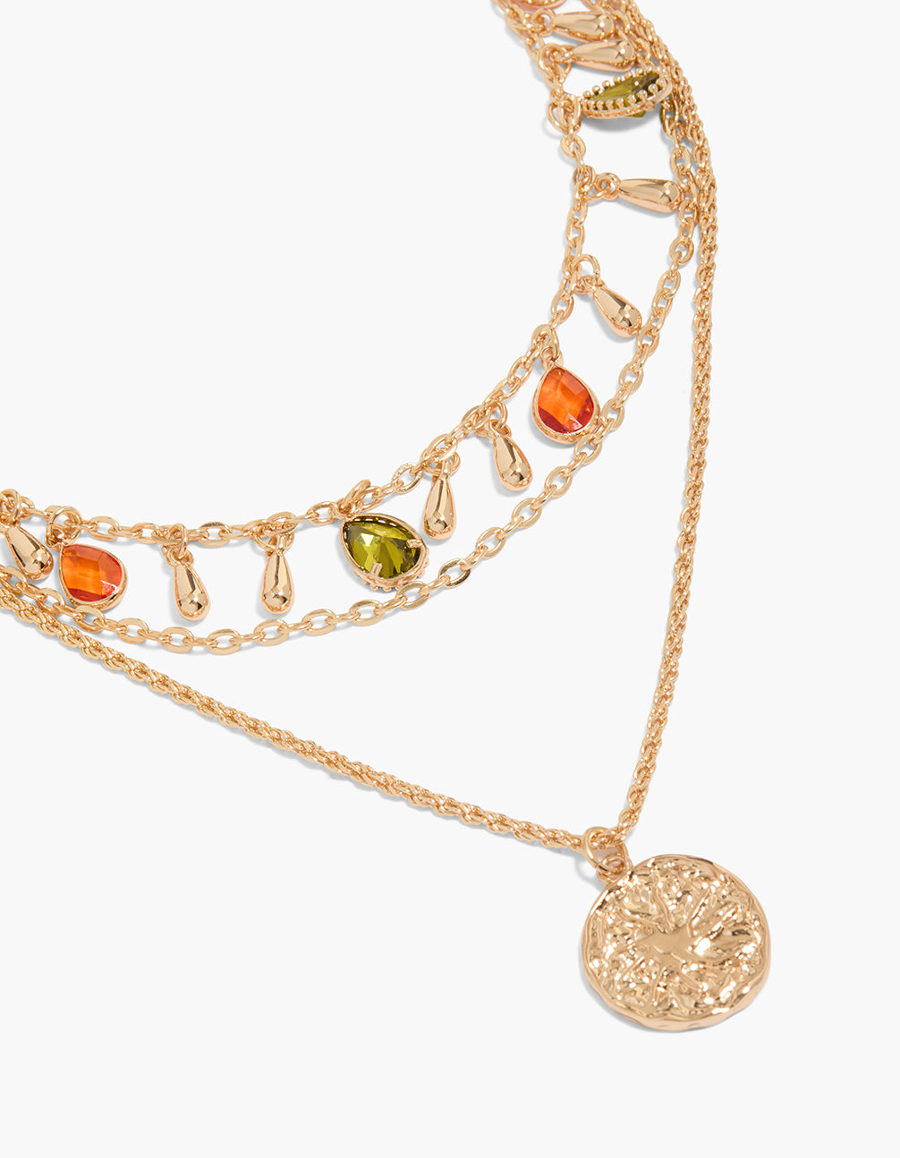 Showcasing a gold orange and green diamante layered necklace with charm details in a statement style close up view