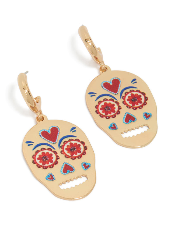 Discover these gold fun skull drop earrings with floral and heart accents front view
