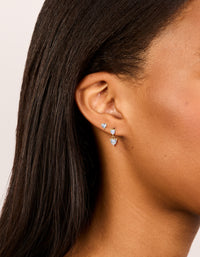 Beautifully crafted waterproof heart-shaped stud and drop earrings featuring gold plated stainless steel with cubic zirconia stones in a statement 2-pack on ear view - link has visual effect only