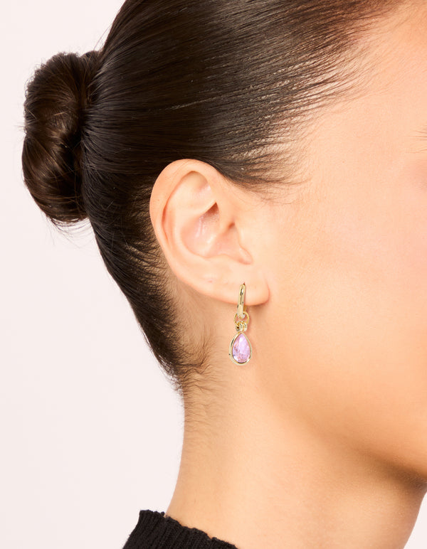 Elegant waterproof gold plated stainless steel pink cubic zirconia pear drop huggie earrings crystal on ear view
