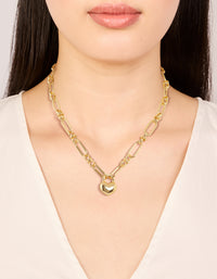 Featuring a waterproof gold plated stainless steel chunky bubble heart statement necklace on neck view - link has visual effect only