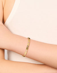 Elegant waterproof gold plated stainless steel hinged bracelet with pink diamante detailing on wrist view - link has visual effect only
