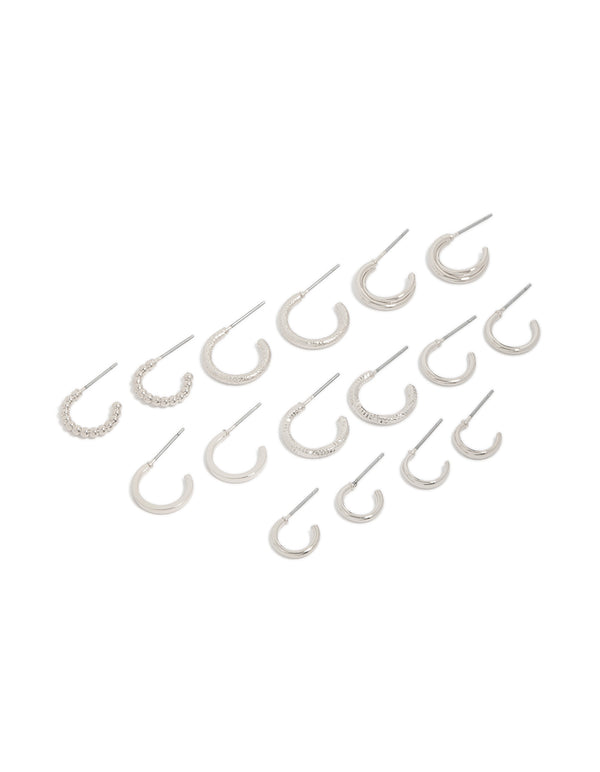 Presenting a set of thin round hoop earrings in silver with 8-pack included front view