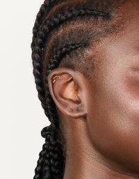 Featuring celestial constellation flat back stud with cubic zirconia in surgical steel gold plated on ear view - link has visual effect only