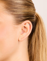 Featuring gold plated surgical steel cubic zirconia blue marquise and circle single flat back stud with crystal and stud closure on ear view - link has visual effect only