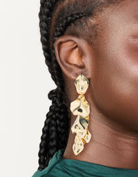 Showcasing statement multi petal drop earrings in gold plated finish on ear view - link has visual effect only