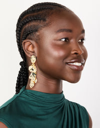 Styled statement multi petal drop earrings in gold plated finish on model view - link has visual effect only