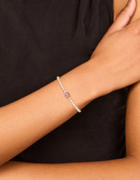 Featuring a gold plated pink cubic zirconia baguette tennis bracelet crafted from crystal on wrist view - link has visual effect only