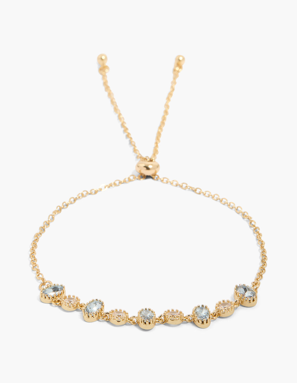 Showcasing a gold plated blue cubic zirconia bracelet with oval and round stone in a dainty style toggle design front view