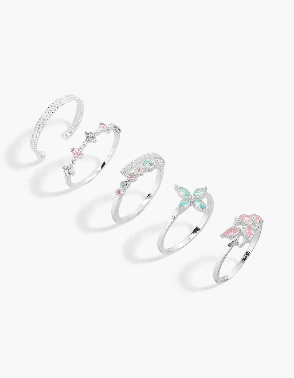 Showcasing a five-pack of statement rings in silver plated metal with floral designs, featuring pink and blue cubic zirconia crystals front view