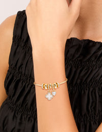 Elegant gold plated cubic zirconia flower and heart toggle bracelet featuring floral charm details on wrist view - link has visual effect only