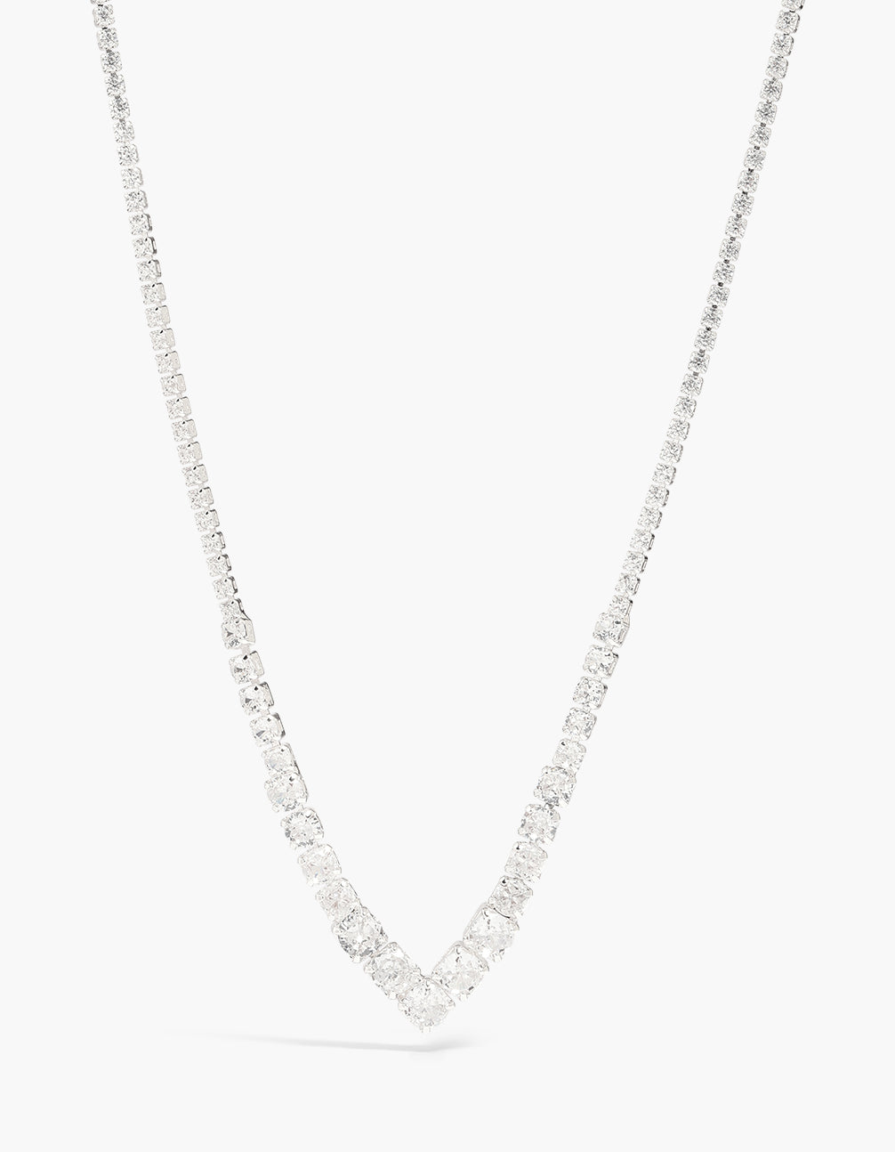 Showcasing a cubic zirconia graduated bezel necklace crafted from plated material in silver close up view